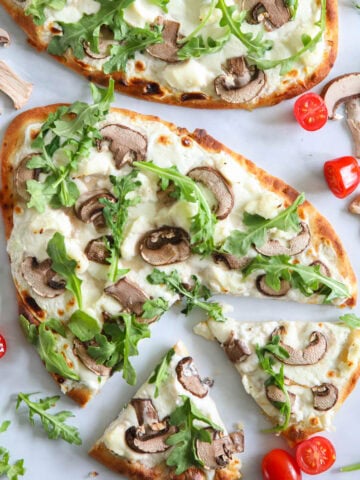 Mushroom Arugula Flatbread Pizza sliced.