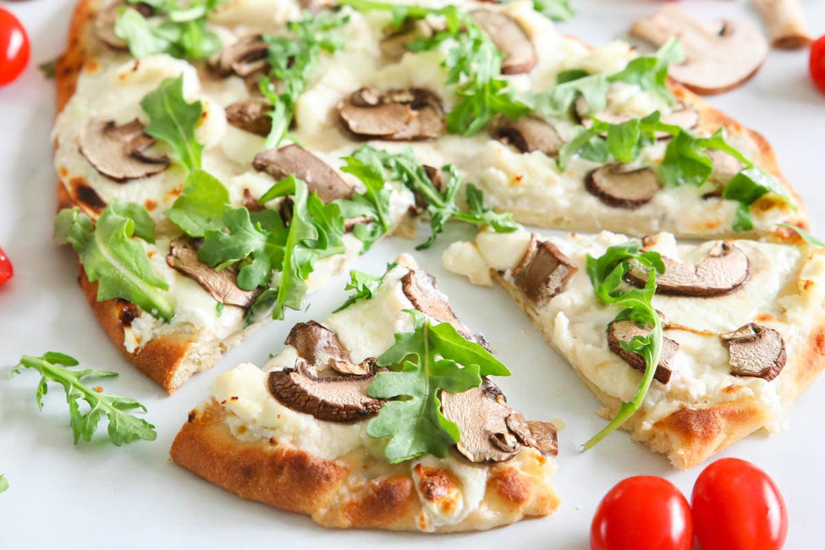 Close up of Mushroom Arugula Flatbread Pizza.