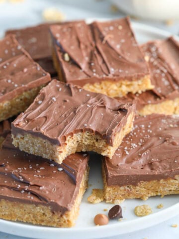 Chewy Special K Bars in a pile, one missing a bite.