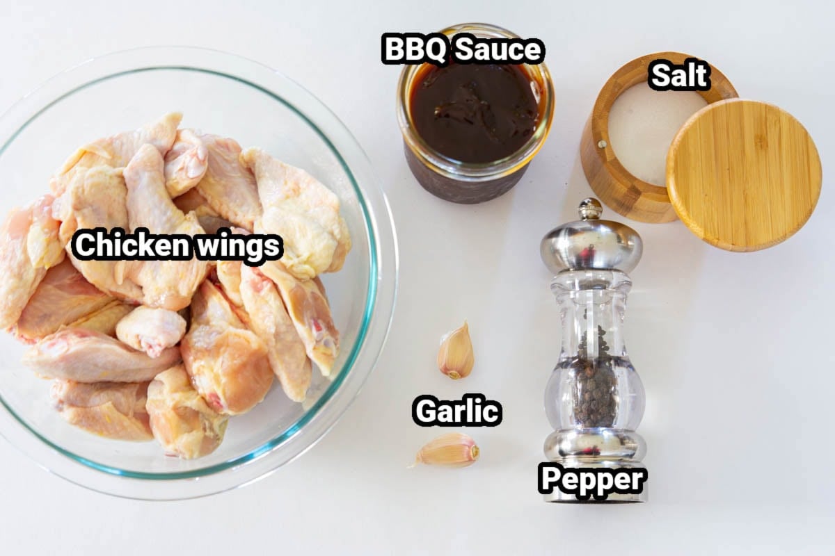 Ingredients for BBQ Chicken Wings: chicken wings, BBQ sauce, salt, garlic cloves, black pepper.