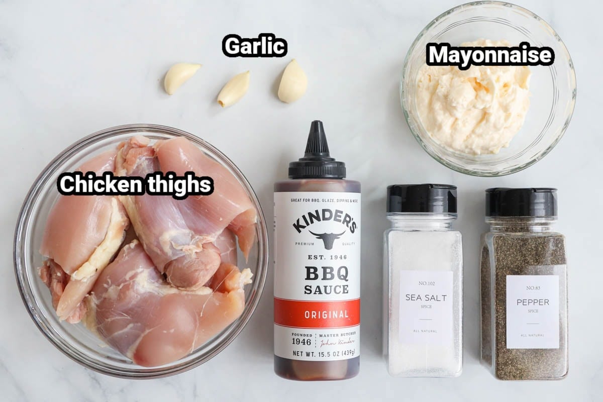 Ingredients for BBQ Chicken Thighs: chicken thighs, garlic, mayonnaise, BBQ sauce, salt, and pepper.