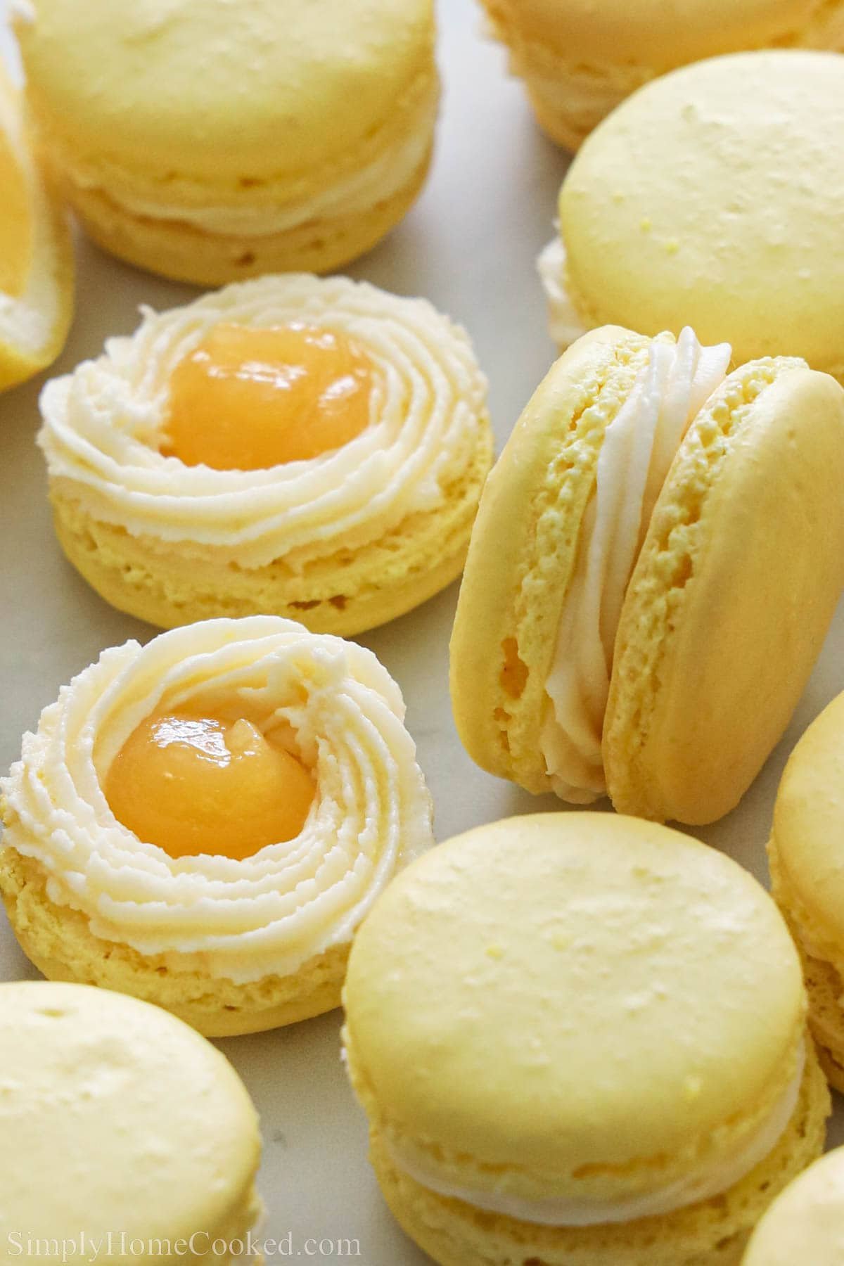 Close up of Lemon Macarons with buttercream and lemon curd in the center.