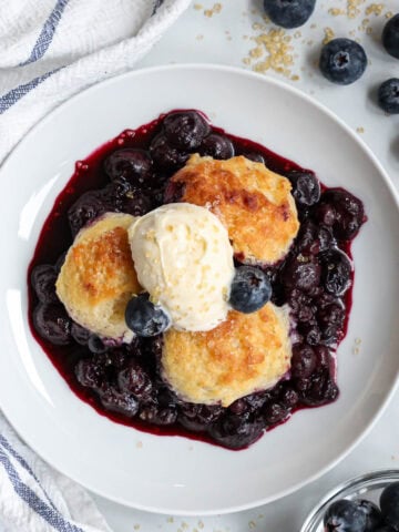 Blueberry Cobbler topped with ice cream.