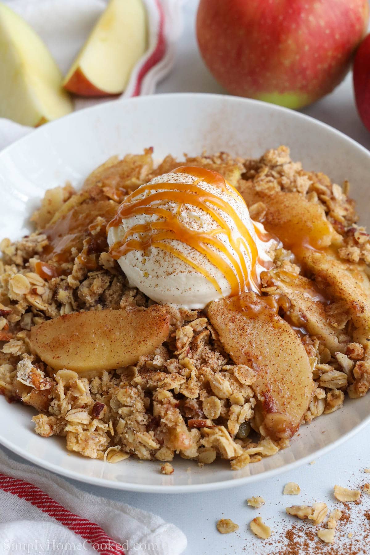 Apple Crisp topped with vanilla ice cream and caramel sauce.