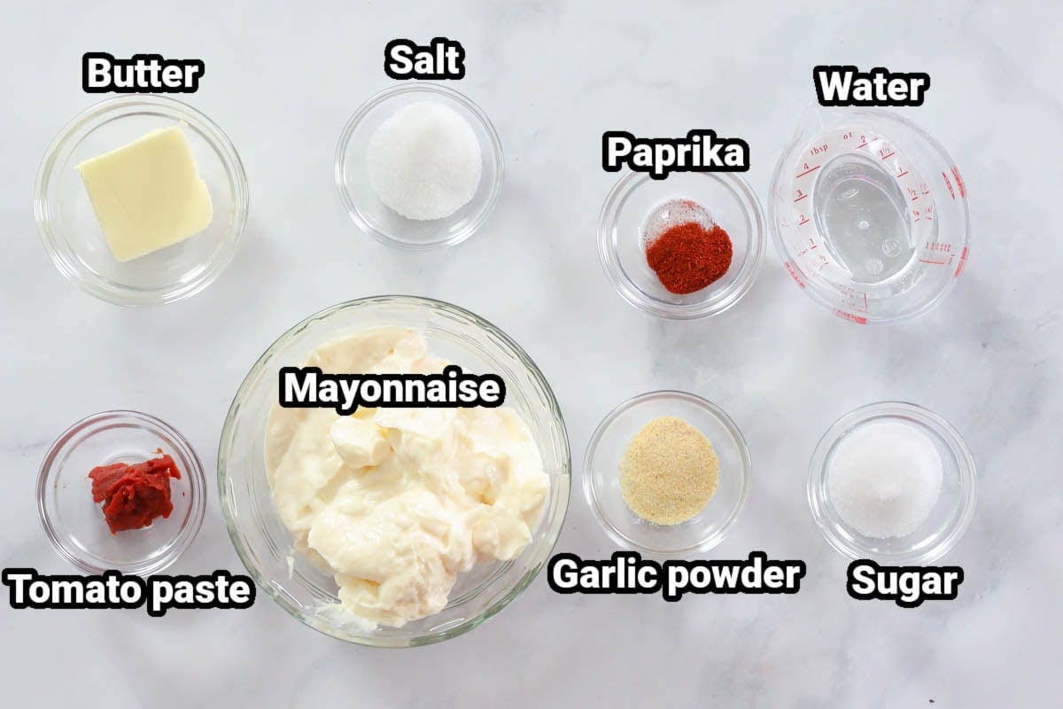 Ingredients for Yum Yum Sauce: butter, tomato paste, salt, paprika, mayonnaise, garlic powder, sugar, and water.