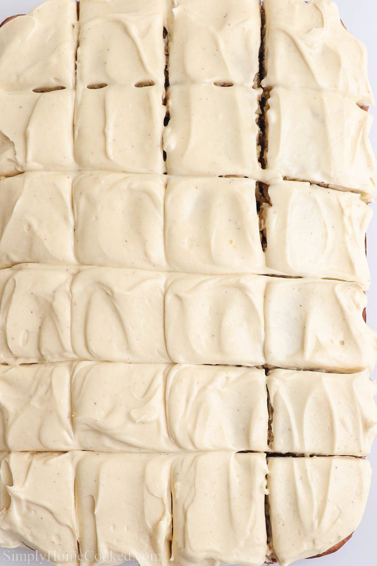 Frosted Banana Cake cut into squares.