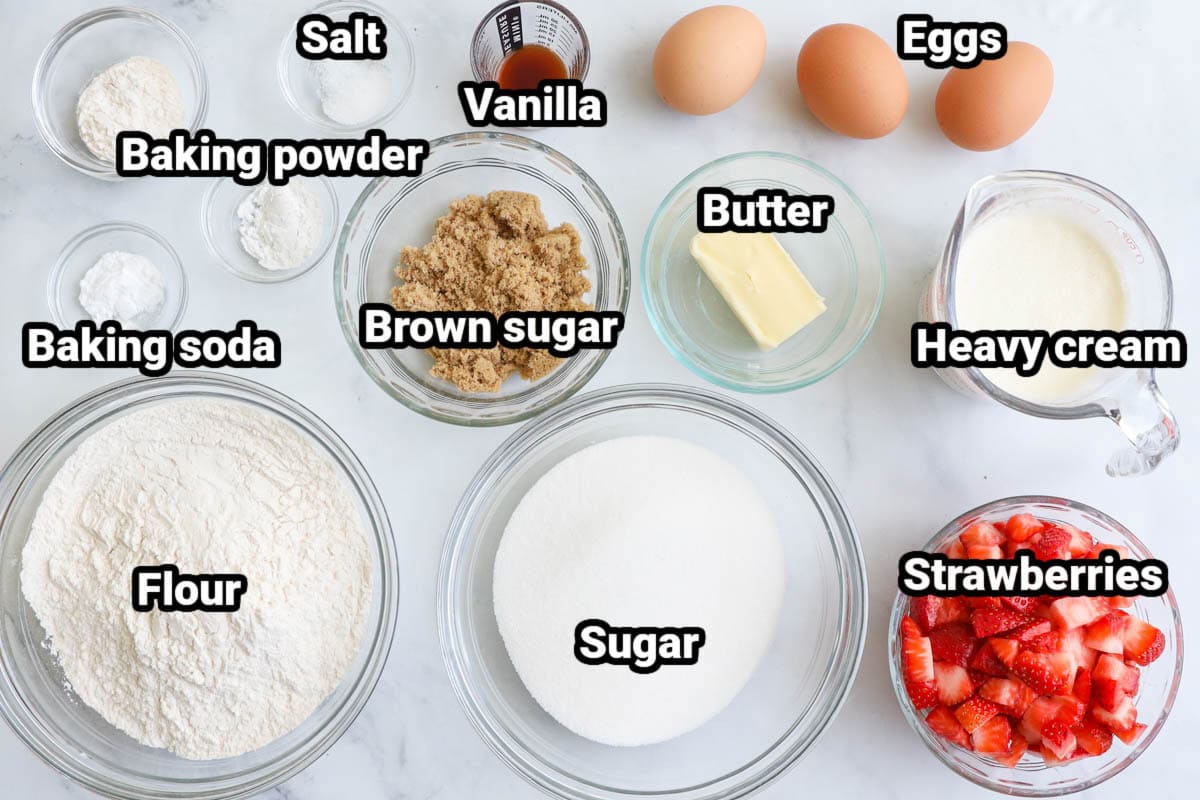 Ingredients for Strawberry Muffins: flour, sugar, brown sugar, baking soda, baking powder, salt vanilla, eggs, butter, heavy cream, and strawberries.
