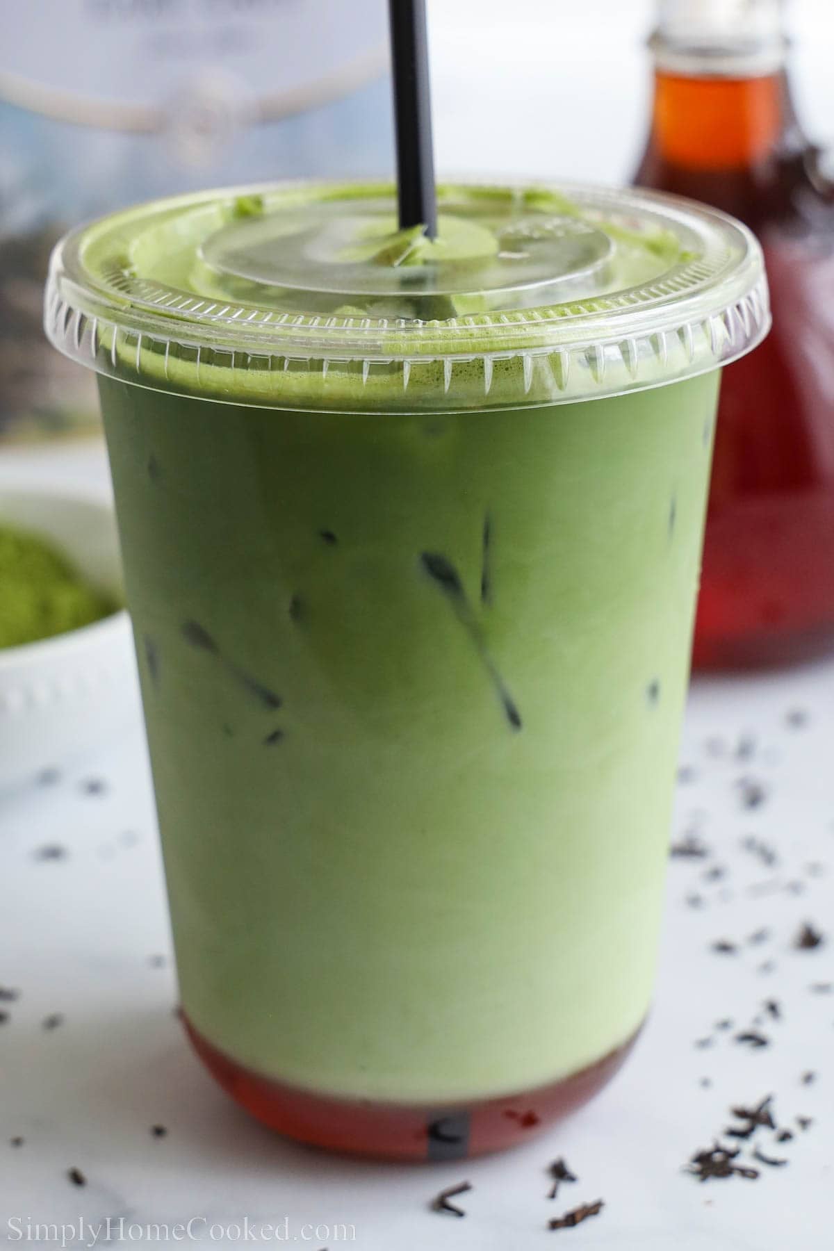 Cup of Earl Grey Matcha with a lid.
