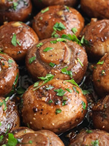 Garlic Butter Mushrooms topped with chopped parsley.