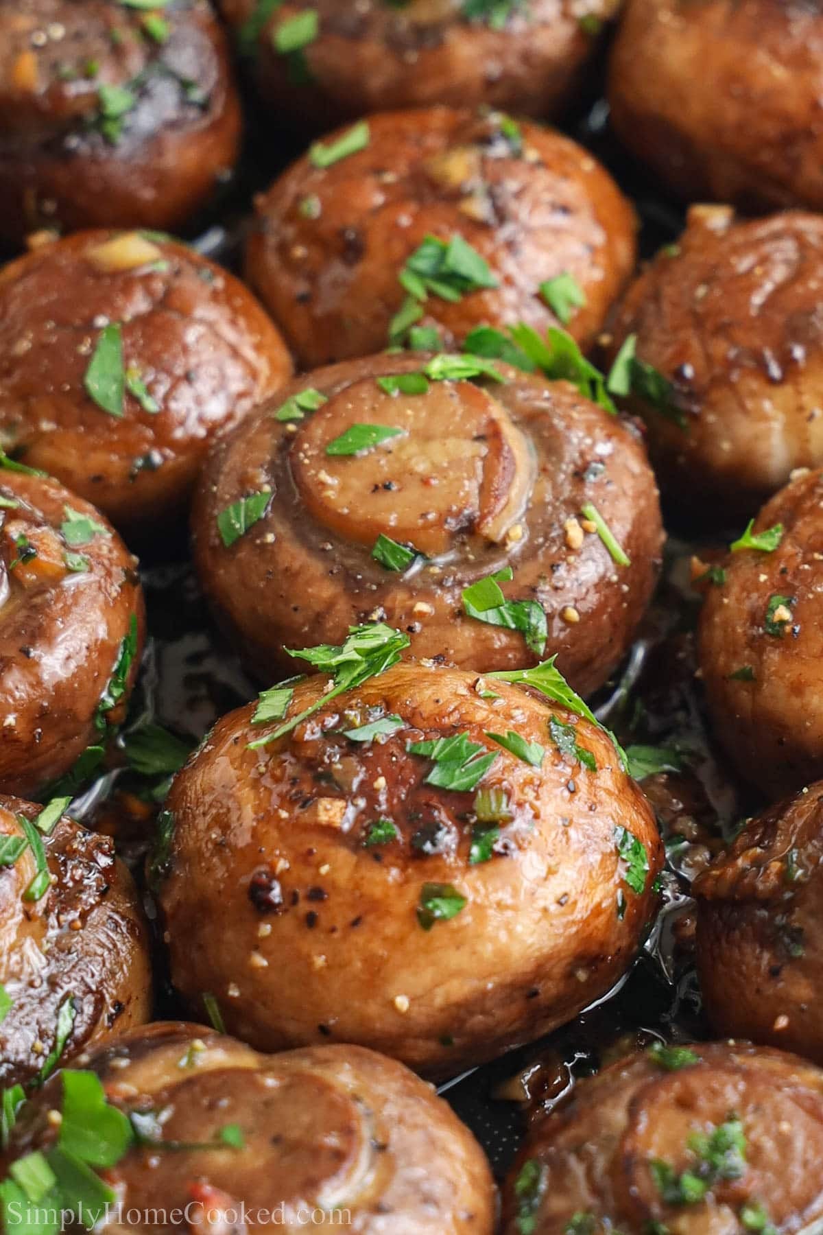Garlic Butter Mushrooms topped with chopped parsley.